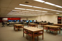 interior view of the Commons showing rows of computers and an area containing tables and chairs